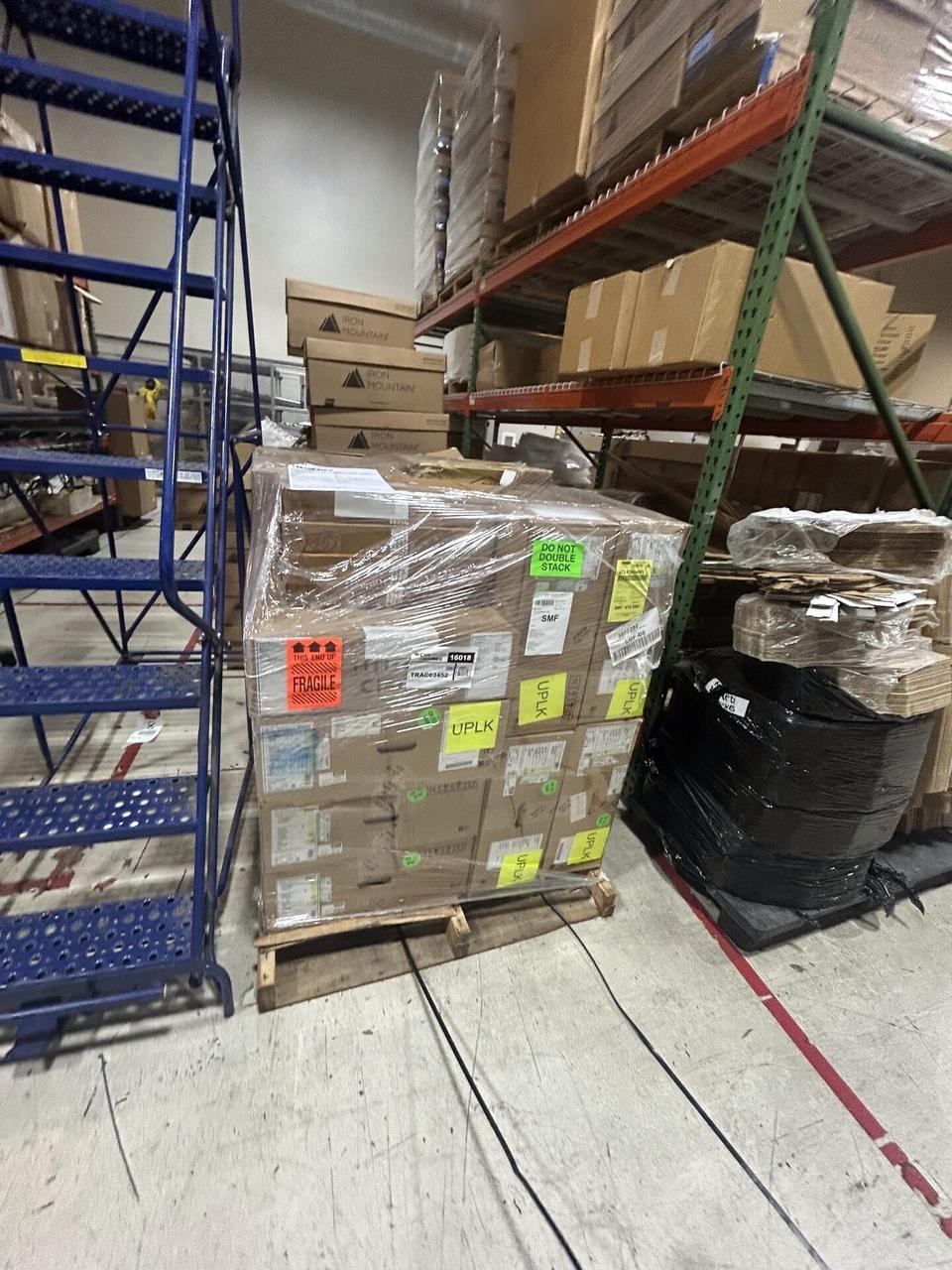 Equipment cabinet cabling and switch handoff with private labels omitted during an Alrty onsite service visit