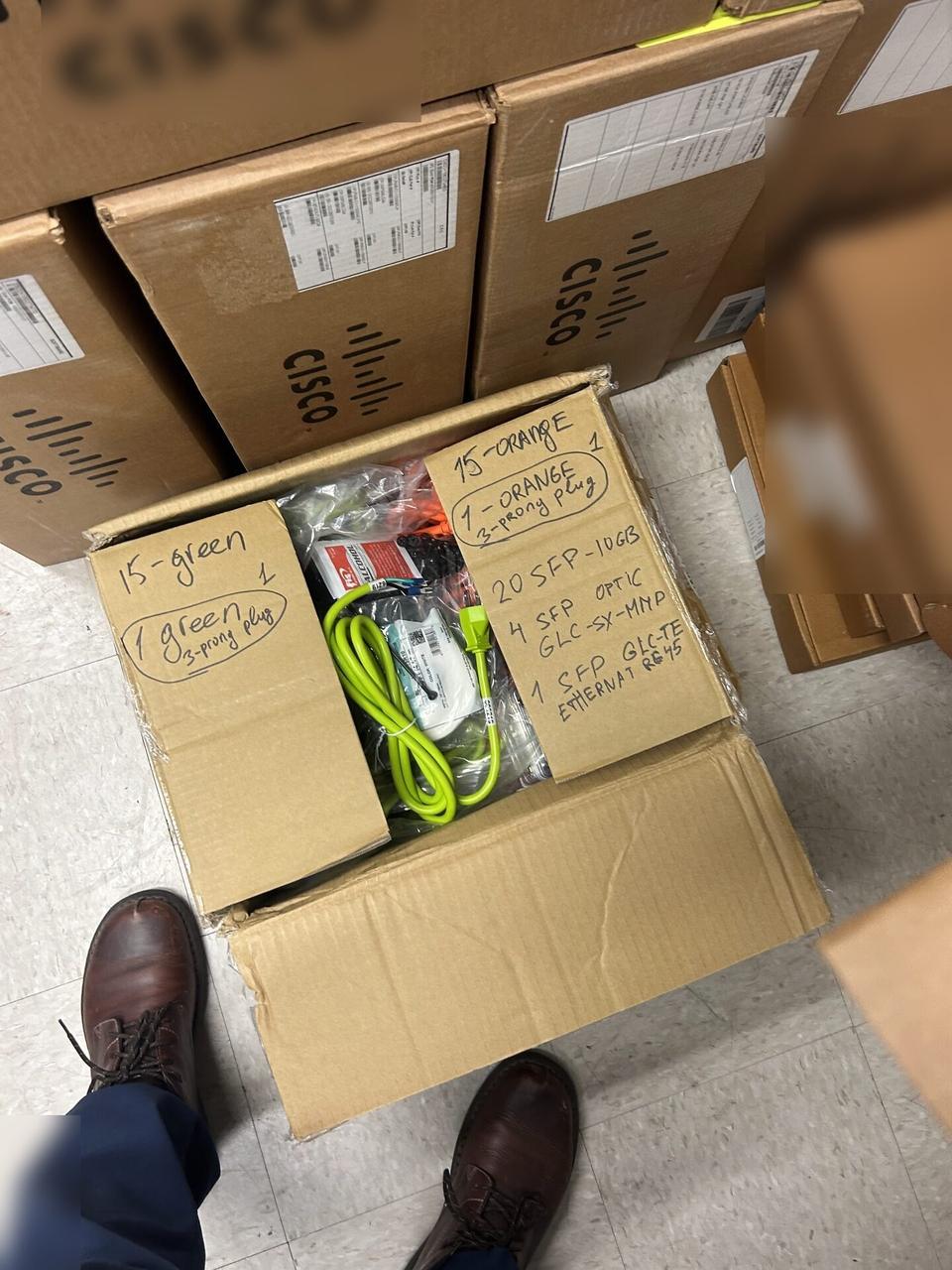 Smart technology service detail: equipment cabinet cabling and switch handoff with private labels omitted