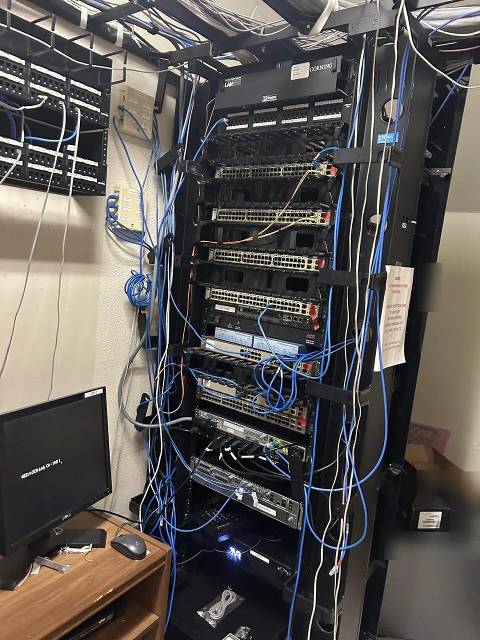 Onsite service photo showing network rack and patch panel cabling with rack cabling organized