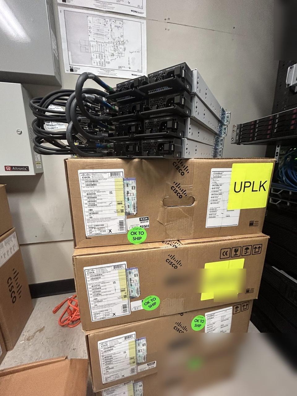 Onsite service photo showing structured cabling inside a network rack during switch or patch-panel service