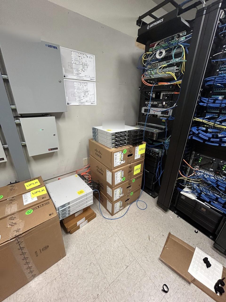 Public-safe portfolio image of structured cabling inside a network rack inside the equipment cabinet