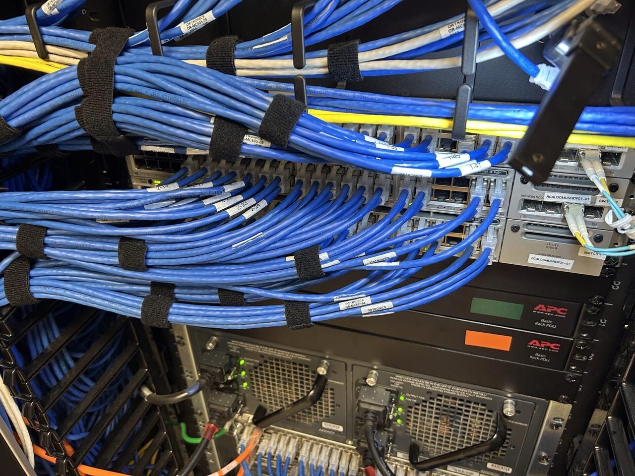 Rack or server-room network equipment with rack cabling organized documented for a smart technology service call