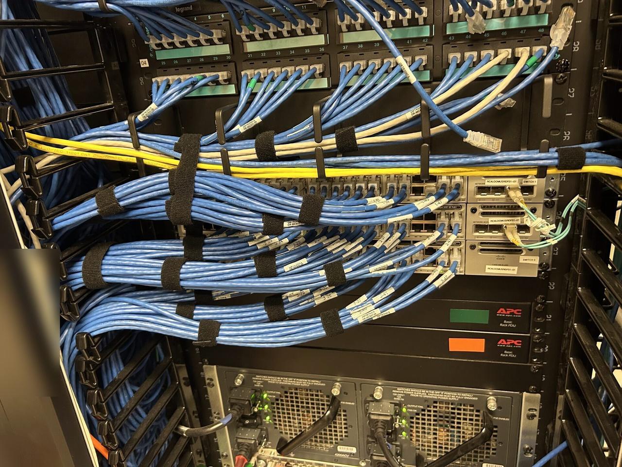 Server-room cabinet and structured network equipment with structured cabling visible documented for a smart technology service call