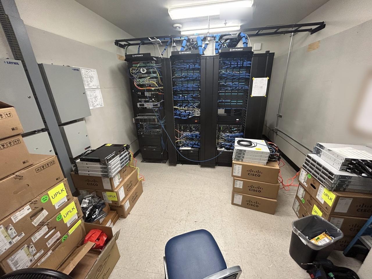 Public-safe portfolio image of structured cabling inside a network rack with rack cabling organized