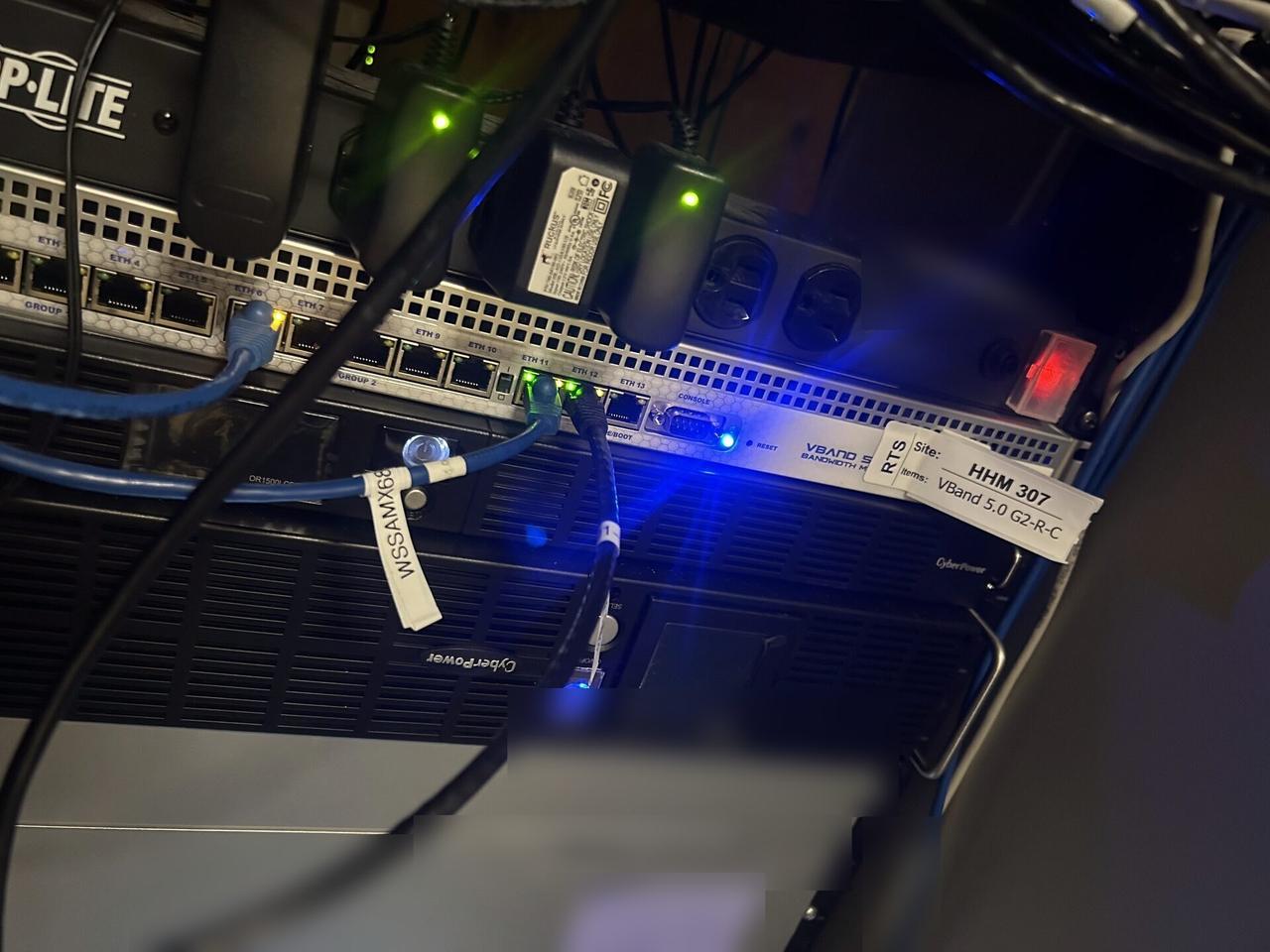 Alrty field photo with rack or server-room network equipment inside the equipment cabinet