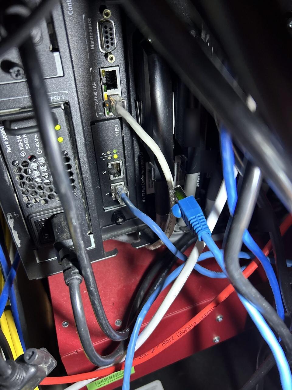 Server-room rack equipment used as network-cabinet context for routed backhaul planning