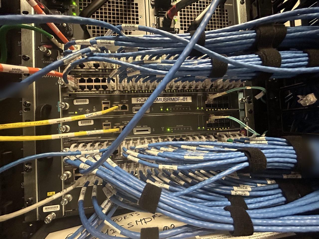 Service documentation showing server-room cabinet and structured network equipment with structured cabling visible