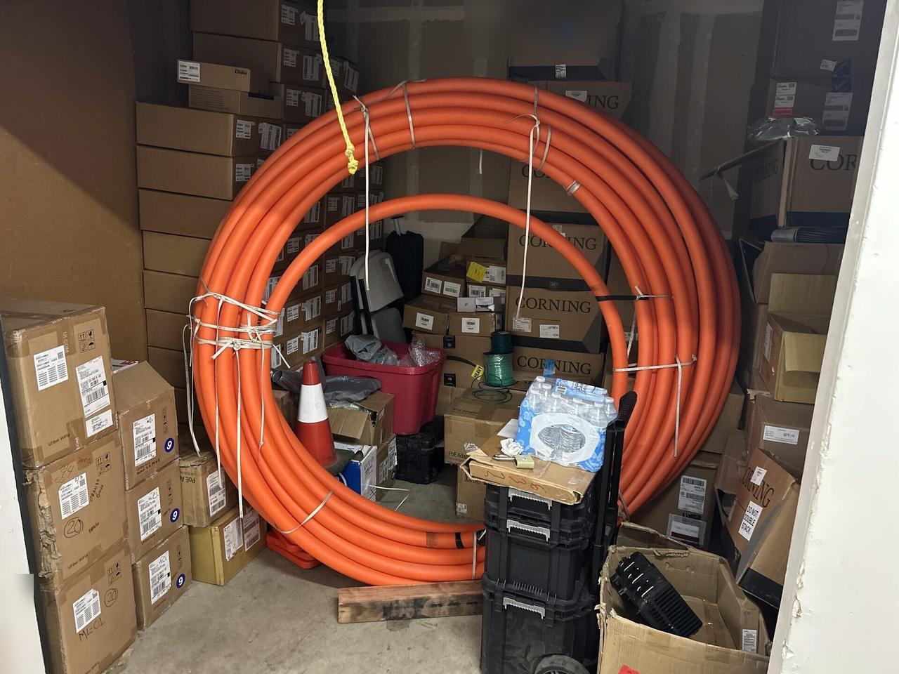 Alrty field photo with optical network equipment during onsite service with private details omitted