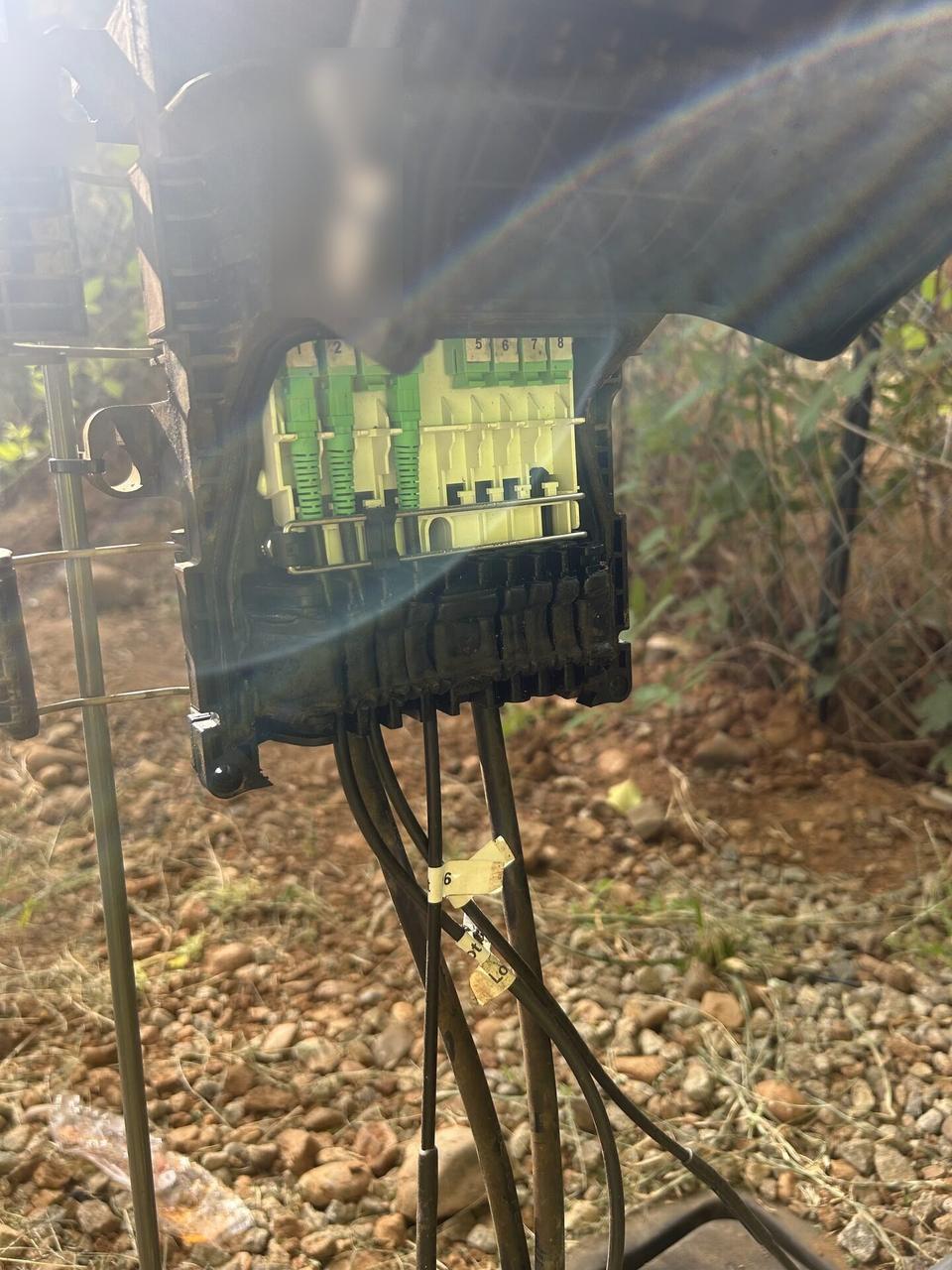 Outdoor fiber distribution unit for customer drops before final signal testing documented for a smart technology service call