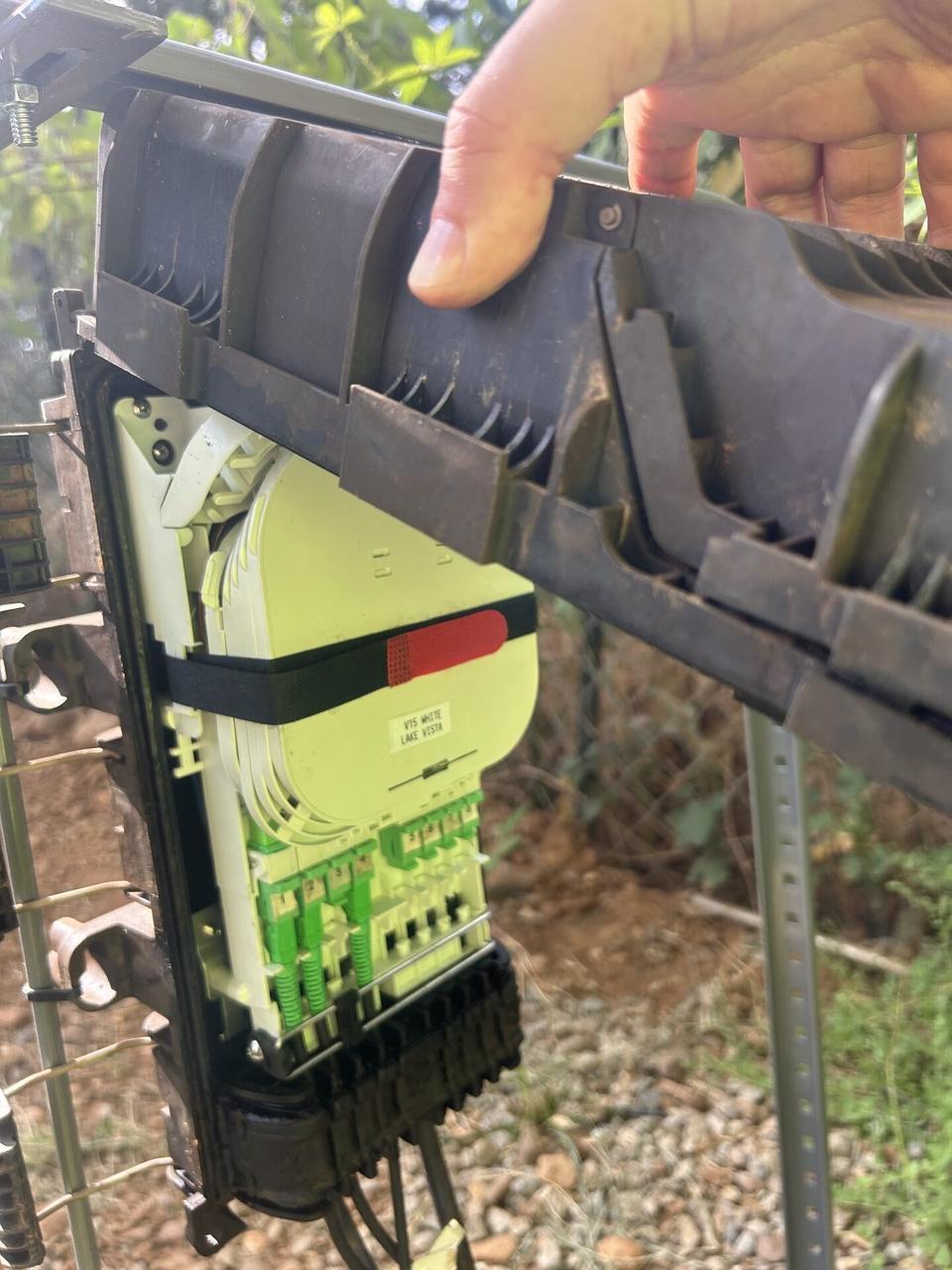 Onsite service photo showing outdoor fiber distribution unit for customer drops at the service handoff point