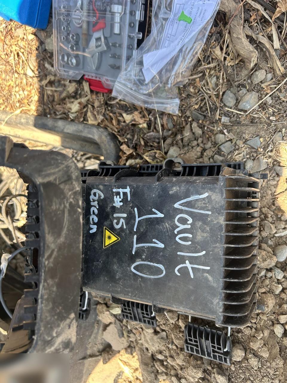 Service documentation showing outdoor fiber distribution unit for customer drops before final signal testing
