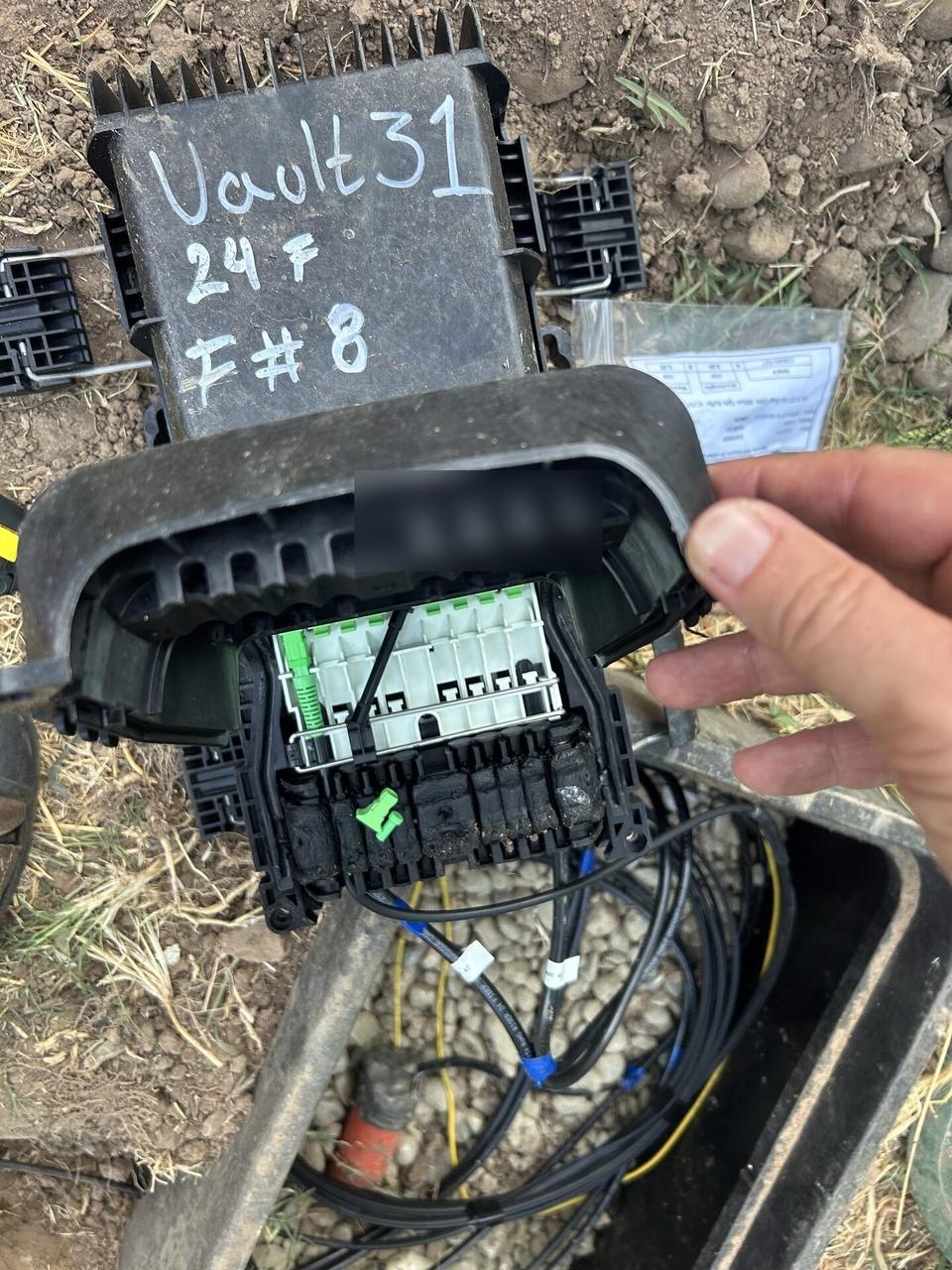 Outdoor fiber distribution unit for customer drops before final signal testing documented for a smart technology service call