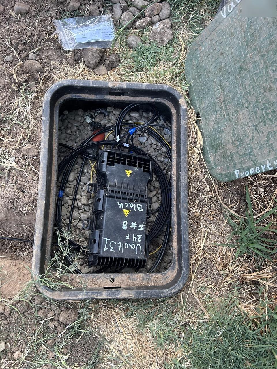 Public-safe portfolio image of outdoor fiber distribution unit for customer drops with private labels omitted