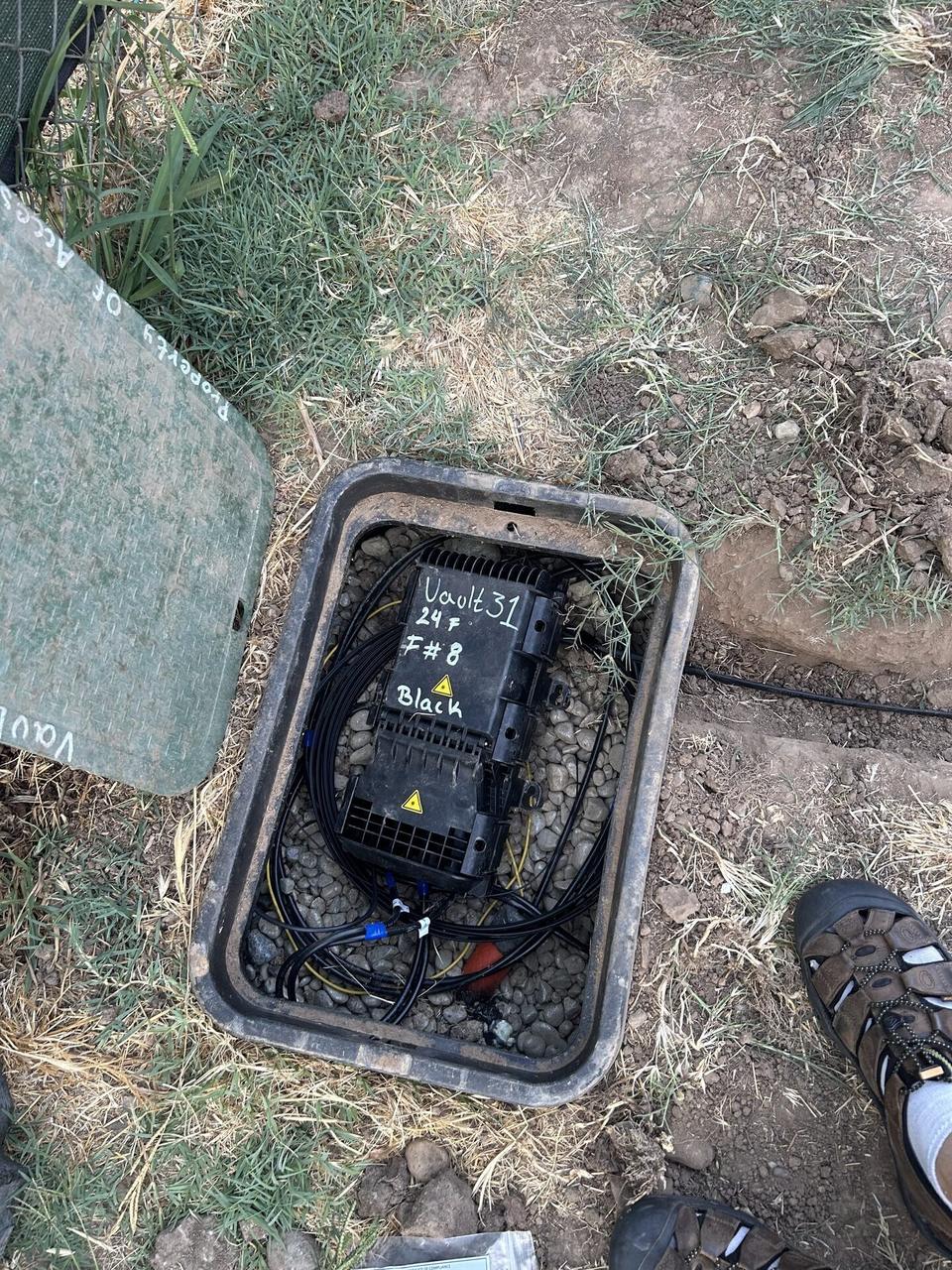 Outdoor fiber distribution unit for customer drops with cable routing visible documented for a smart technology service call