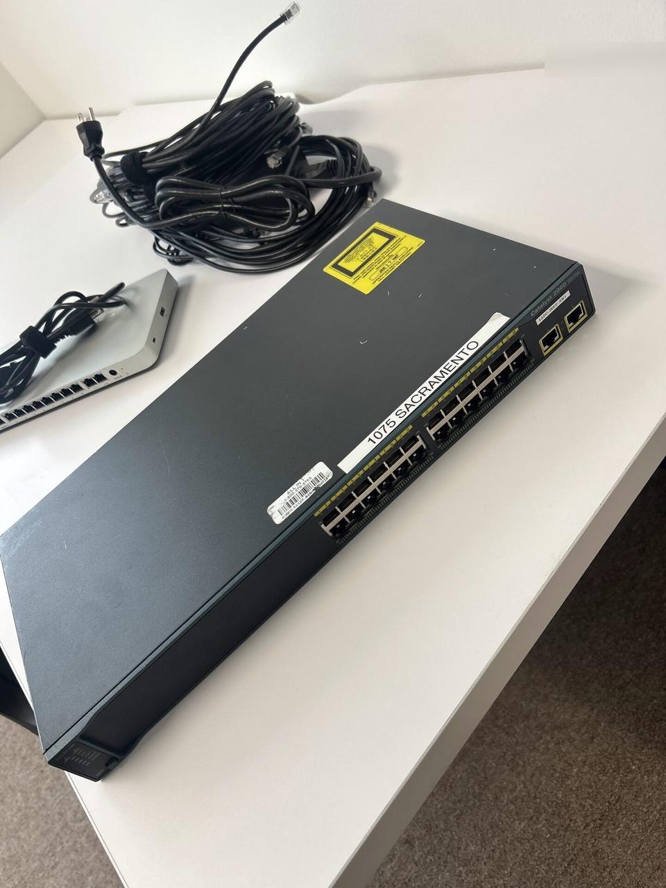 Onsite service photo showing wireless access point and router setup detail during connectivity validation