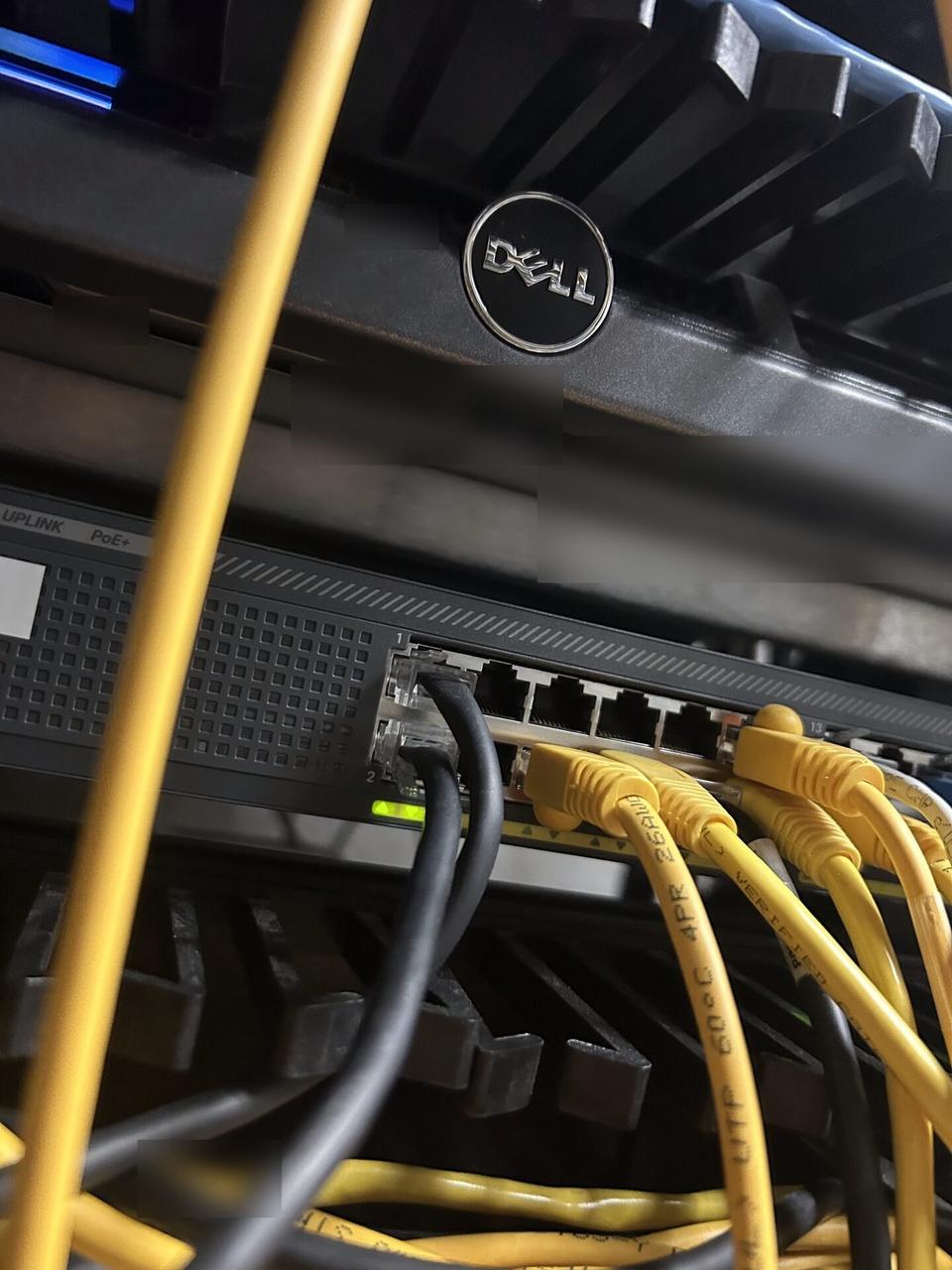 Alrty portfolio view of low-voltage hardware and device cabling with wall routing visible