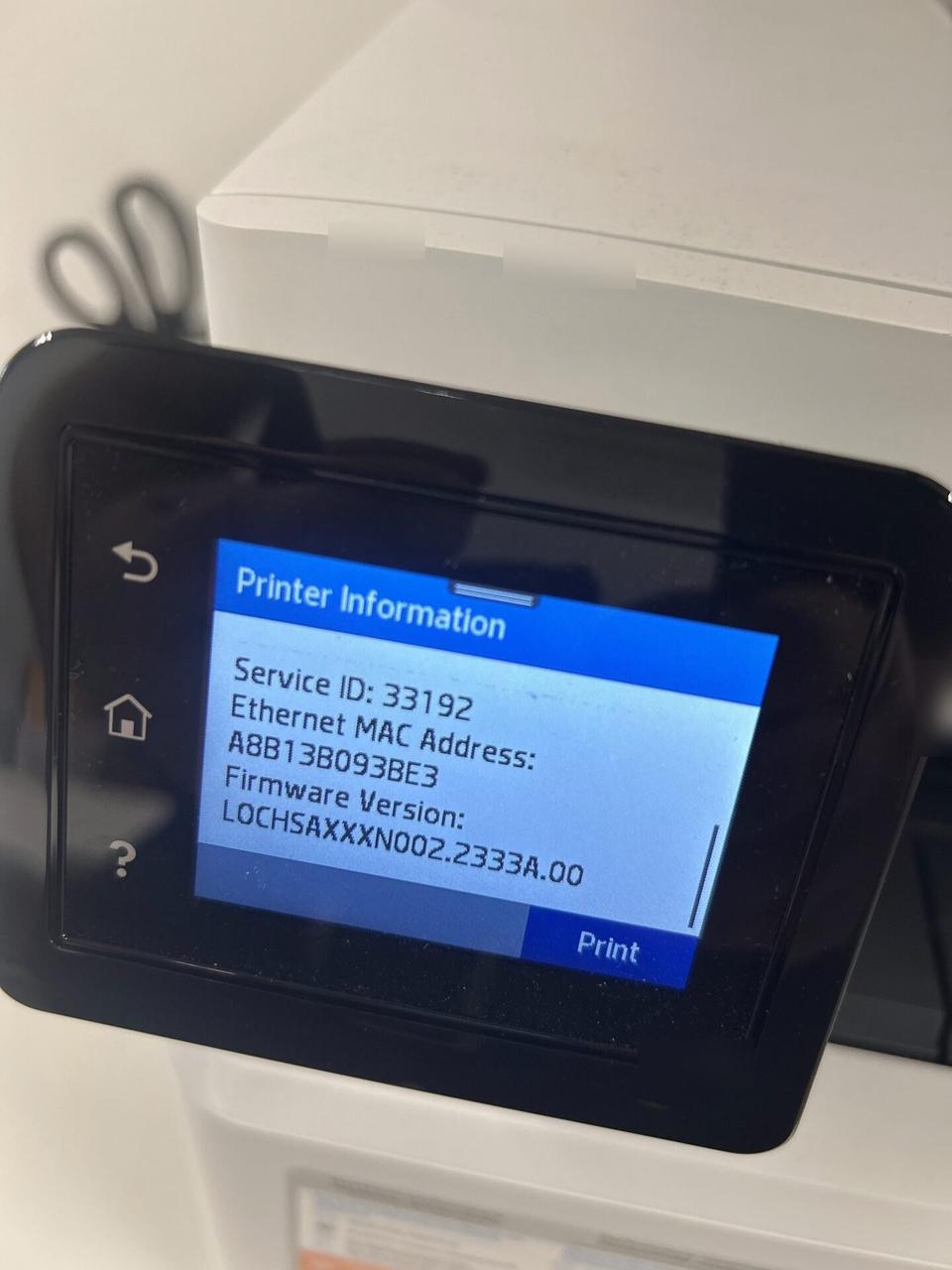 Onsite service photo showing business printer setup at the service location with cabling or placement context