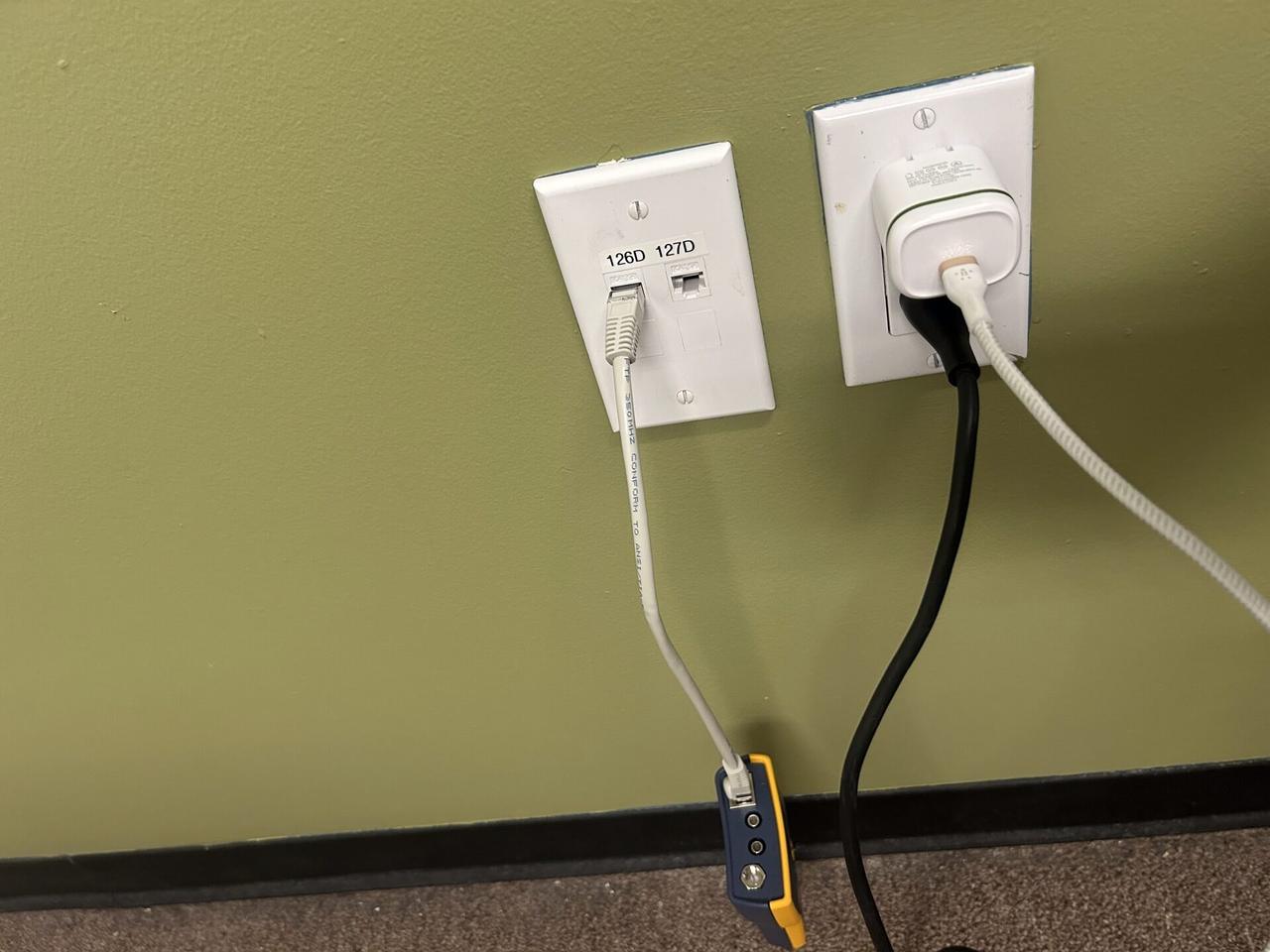 Public-safe portfolio image of wall plate and low-voltage wiring service with connectors or plates visible