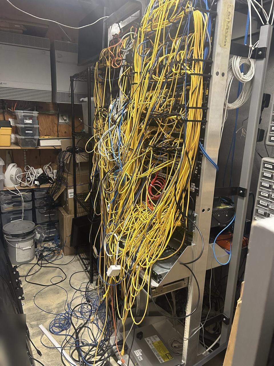 Rack-mounted network hardware during service before final connectivity checks during an Alrty onsite service visit