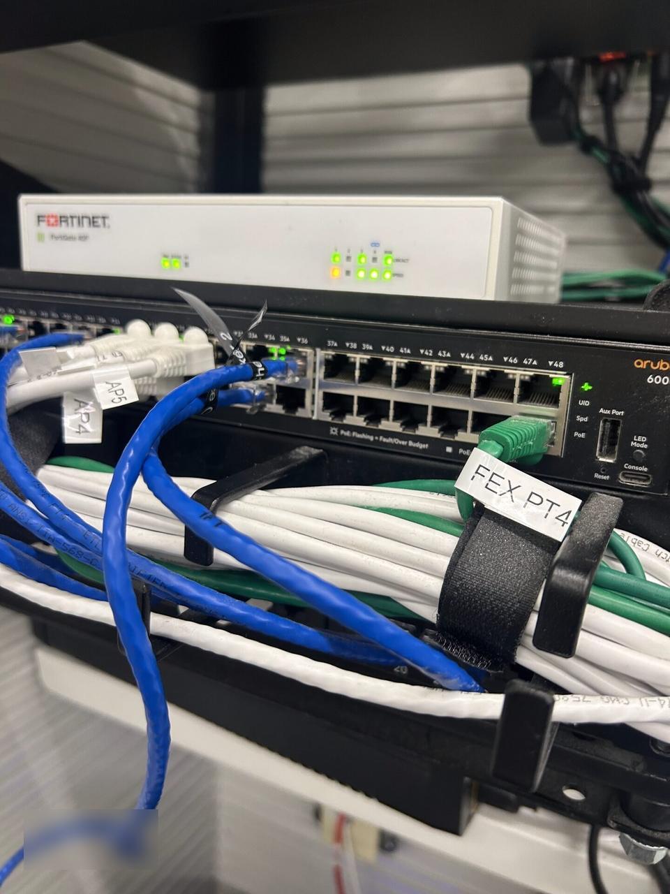 Alrty field photo with low-voltage hardware and device cabling with wall routing visible