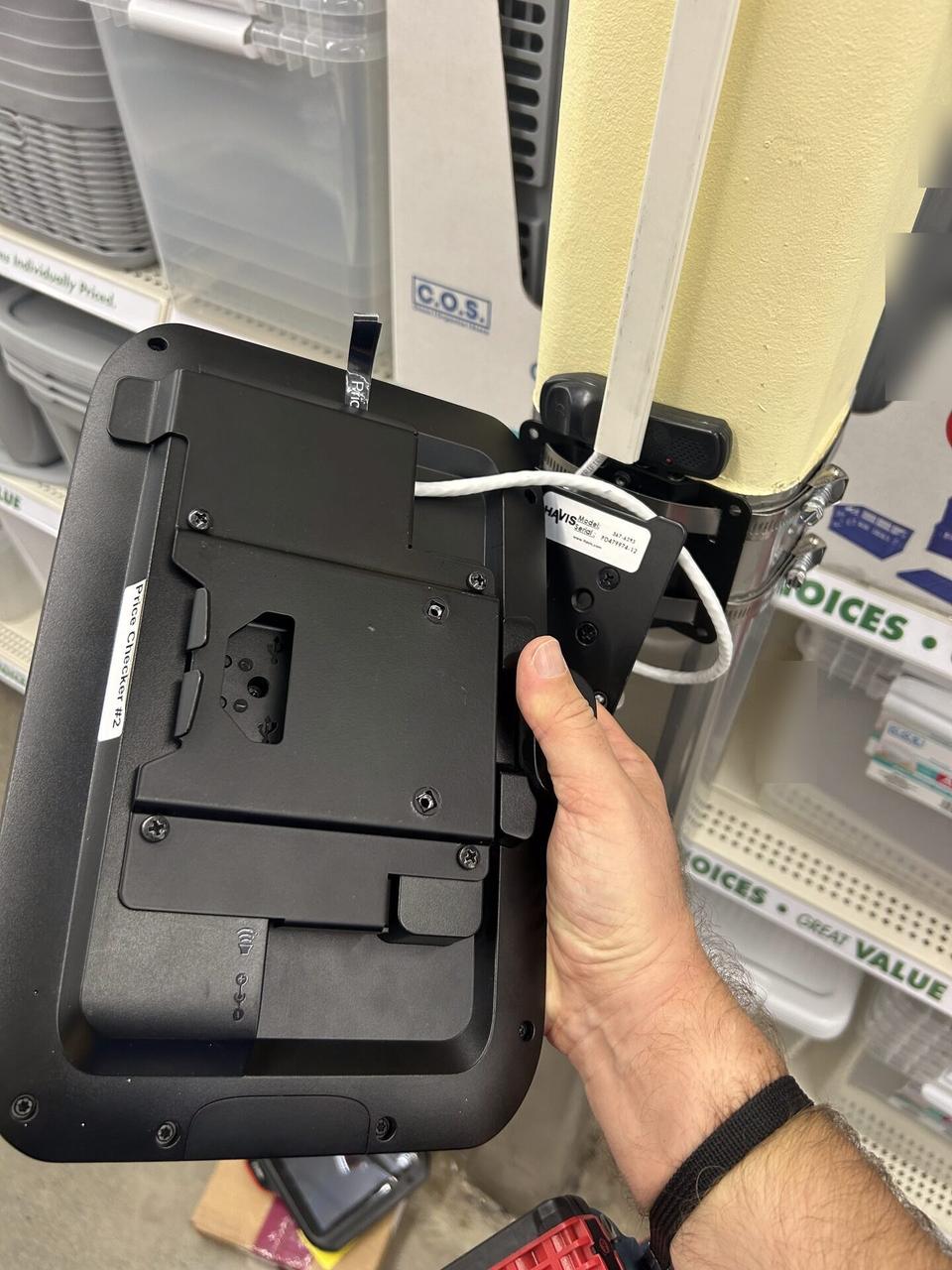 Onsite service photo showing retail price checker and POS lookup station