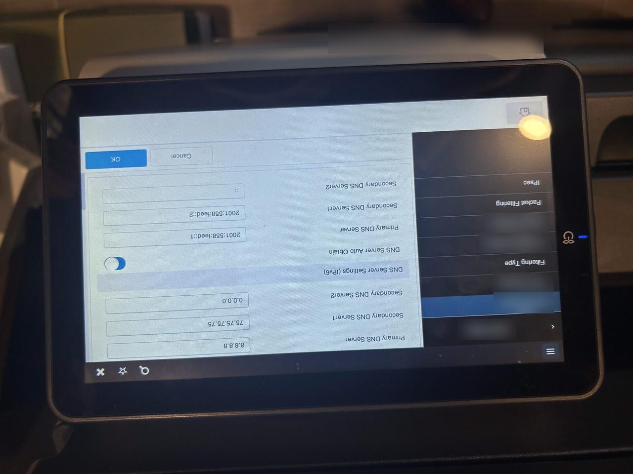 Onsite service photo showing peripheral device support for office technology with private labels omitted