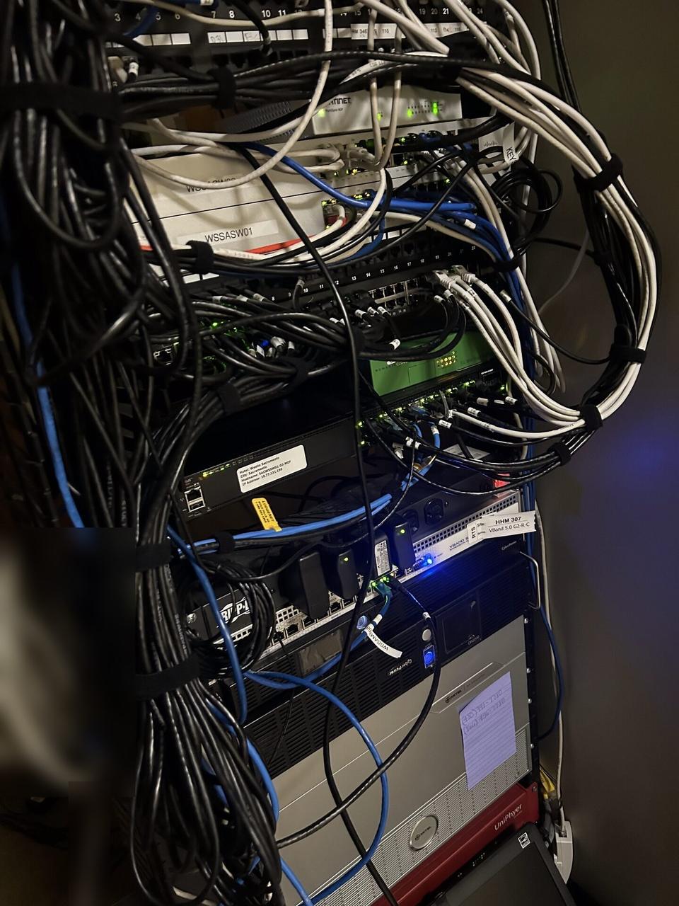 Public-safe portfolio image of structured cabling inside a network rack with structured cabling visible