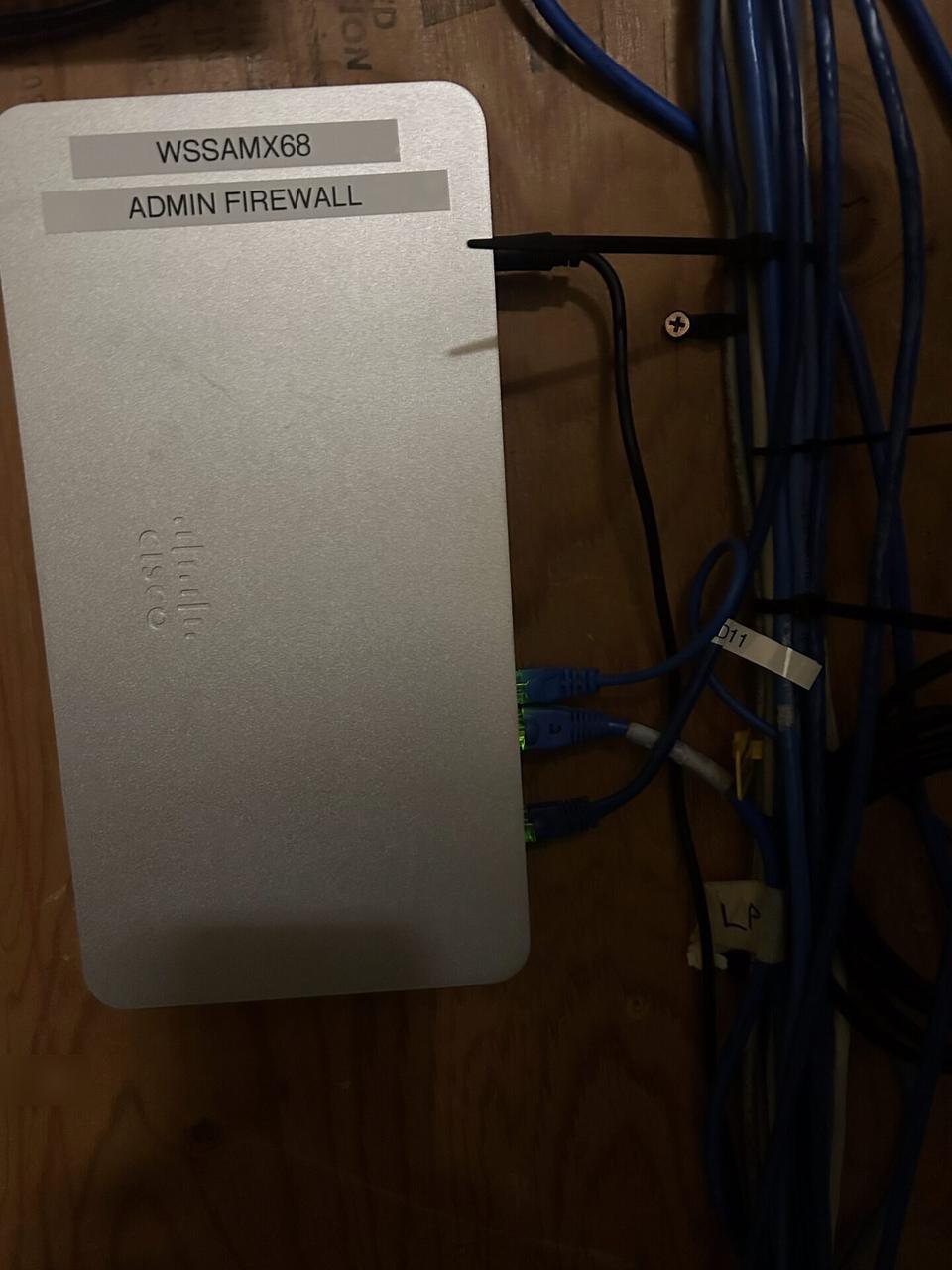 Rack-mounted network hardware during service before final connectivity checks during an Alrty onsite service visit