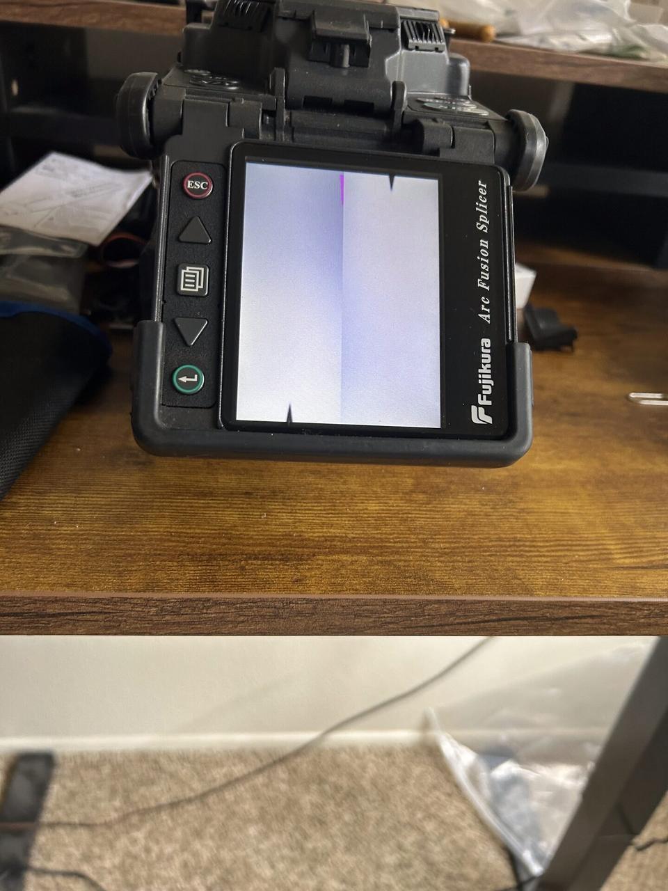 Alrty field photo with fiber testing or optical signal verification with private details omitted