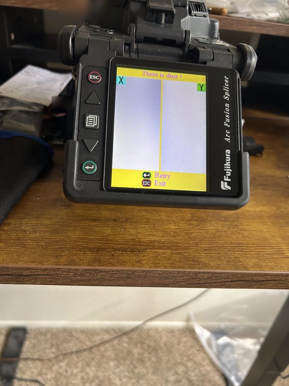 Alrty field photo with fiber splicing and cable preparation detail at the service handoff point
