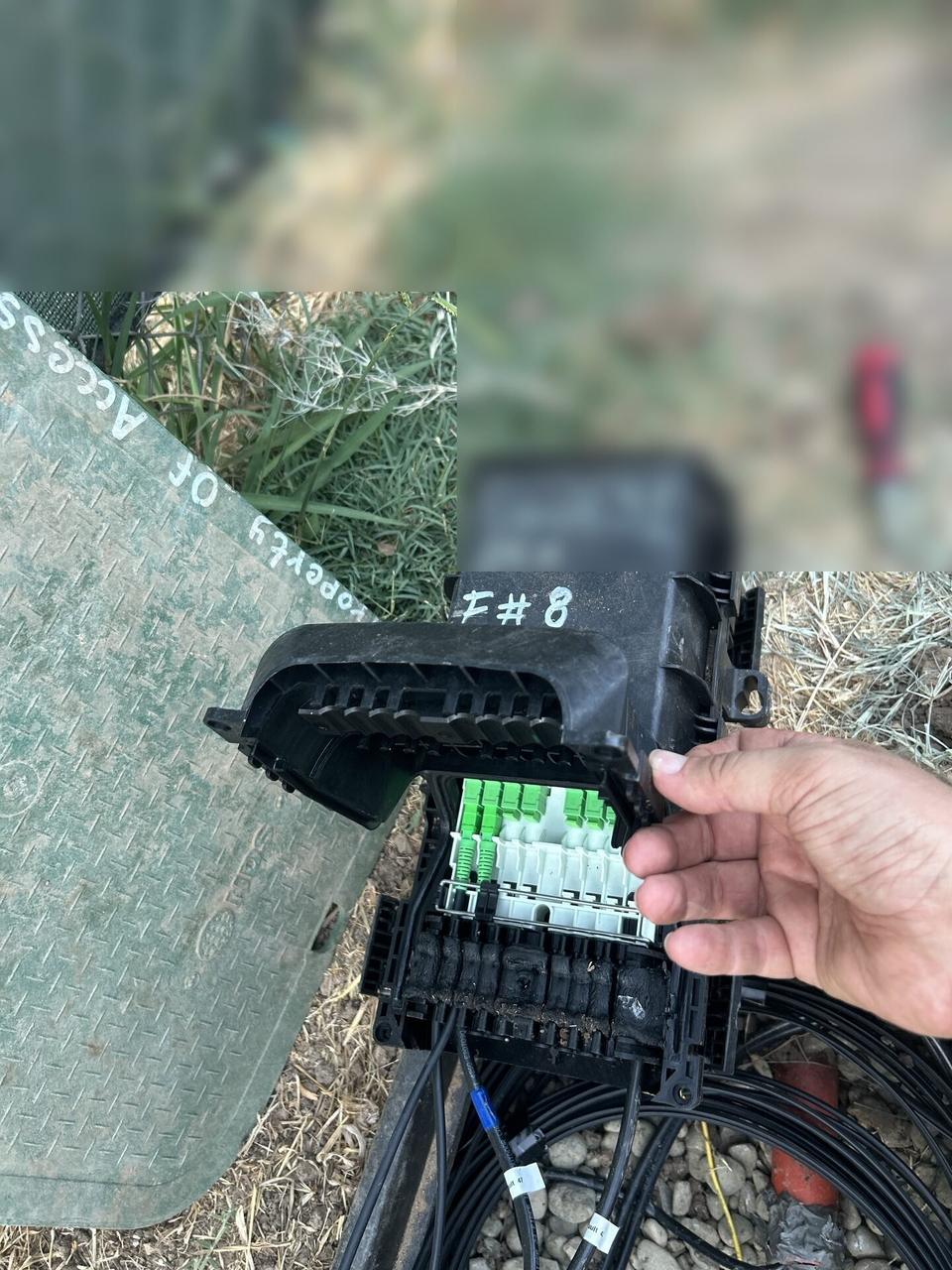 Alrty field photo with outdoor fiber distribution unit for customer drops with tools or ports visible