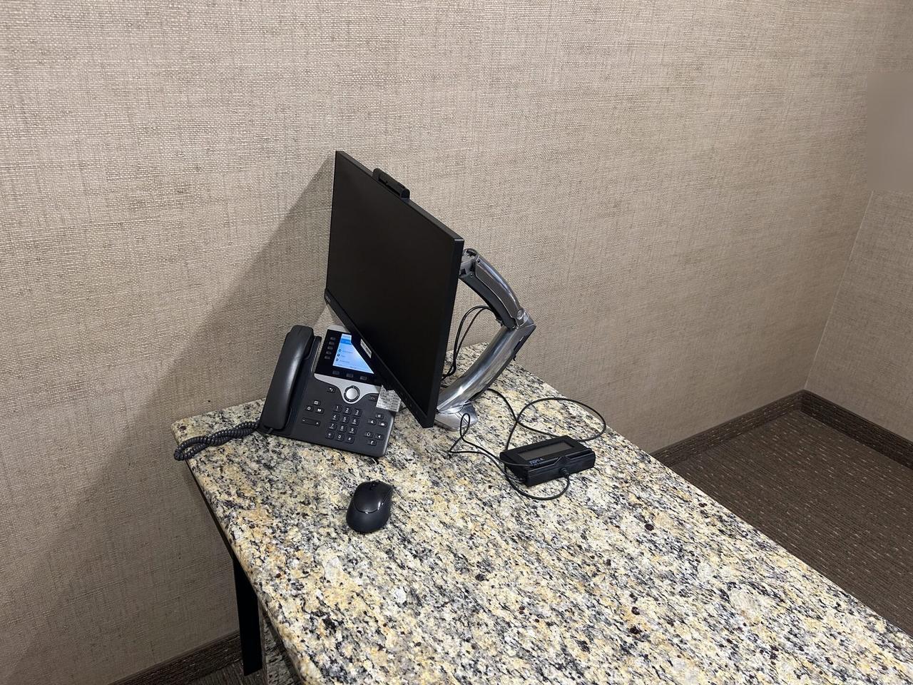 Smart technology service detail: computer station setup with connected peripherals at a business workstation