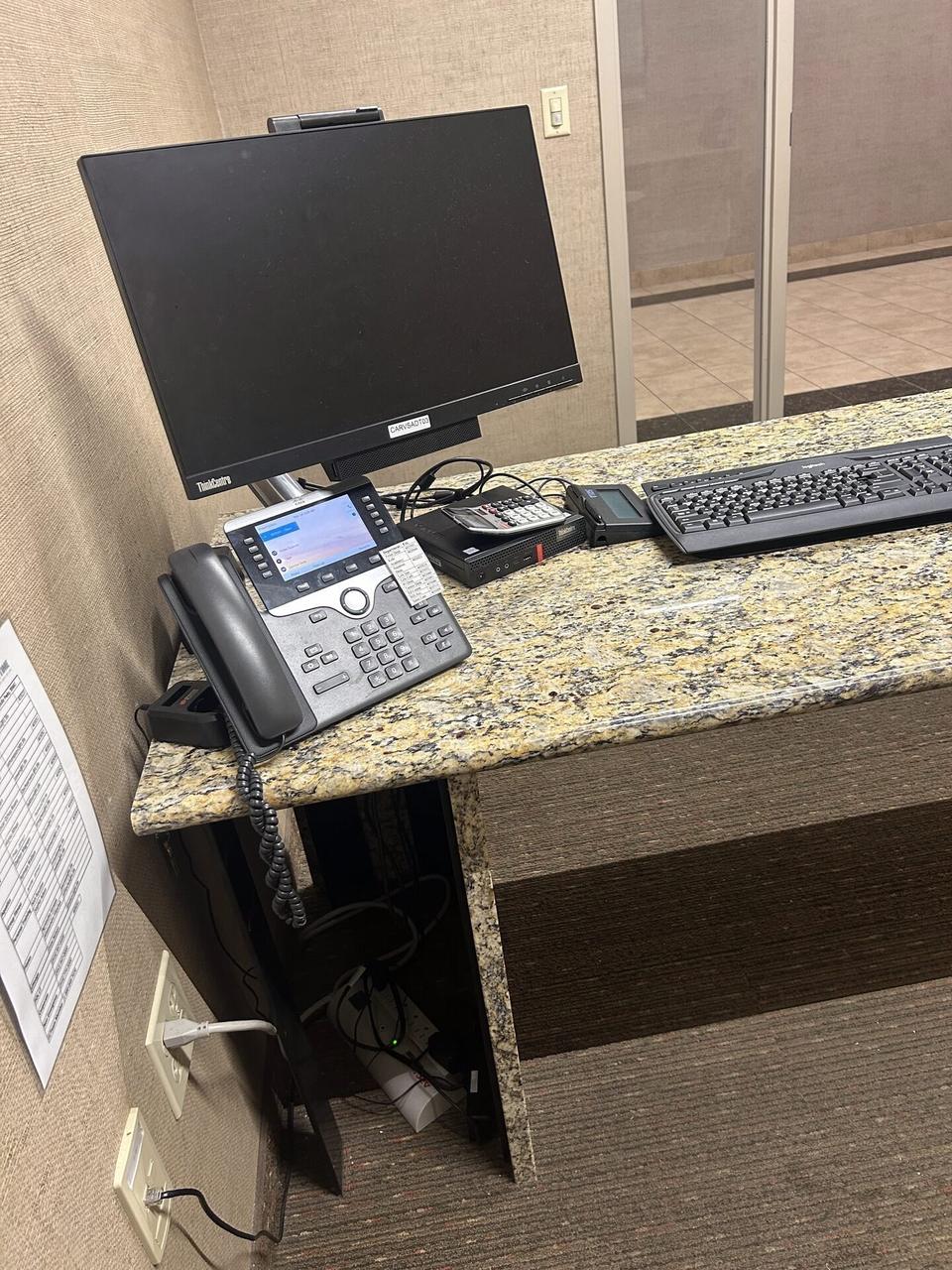 Service documentation showing computer station setup with connected peripherals with peripherals in service context