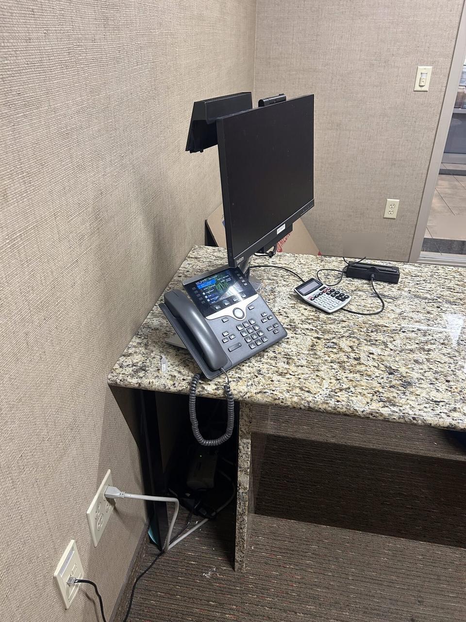 Office workstation setup with monitors during workstation validation during an Alrty onsite service visit