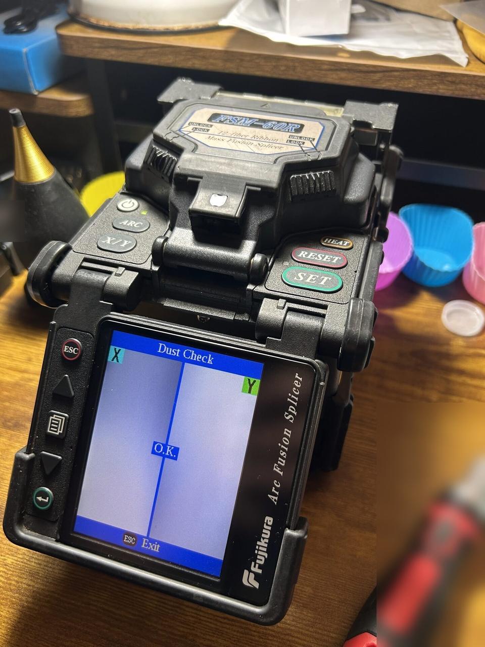 Fiber fusion splicer service work documented for a smart technology service call