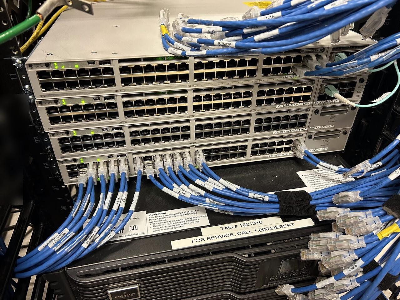 Alrty field photo with rack-mounted network hardware during service at the server-room handoff point