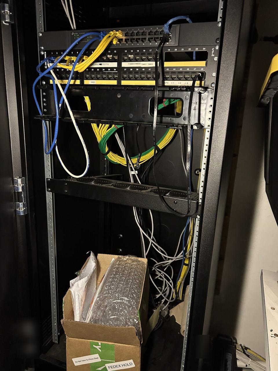 Alrty field photo with equipment cabinet cabling and switch handoff with rack cabling organized