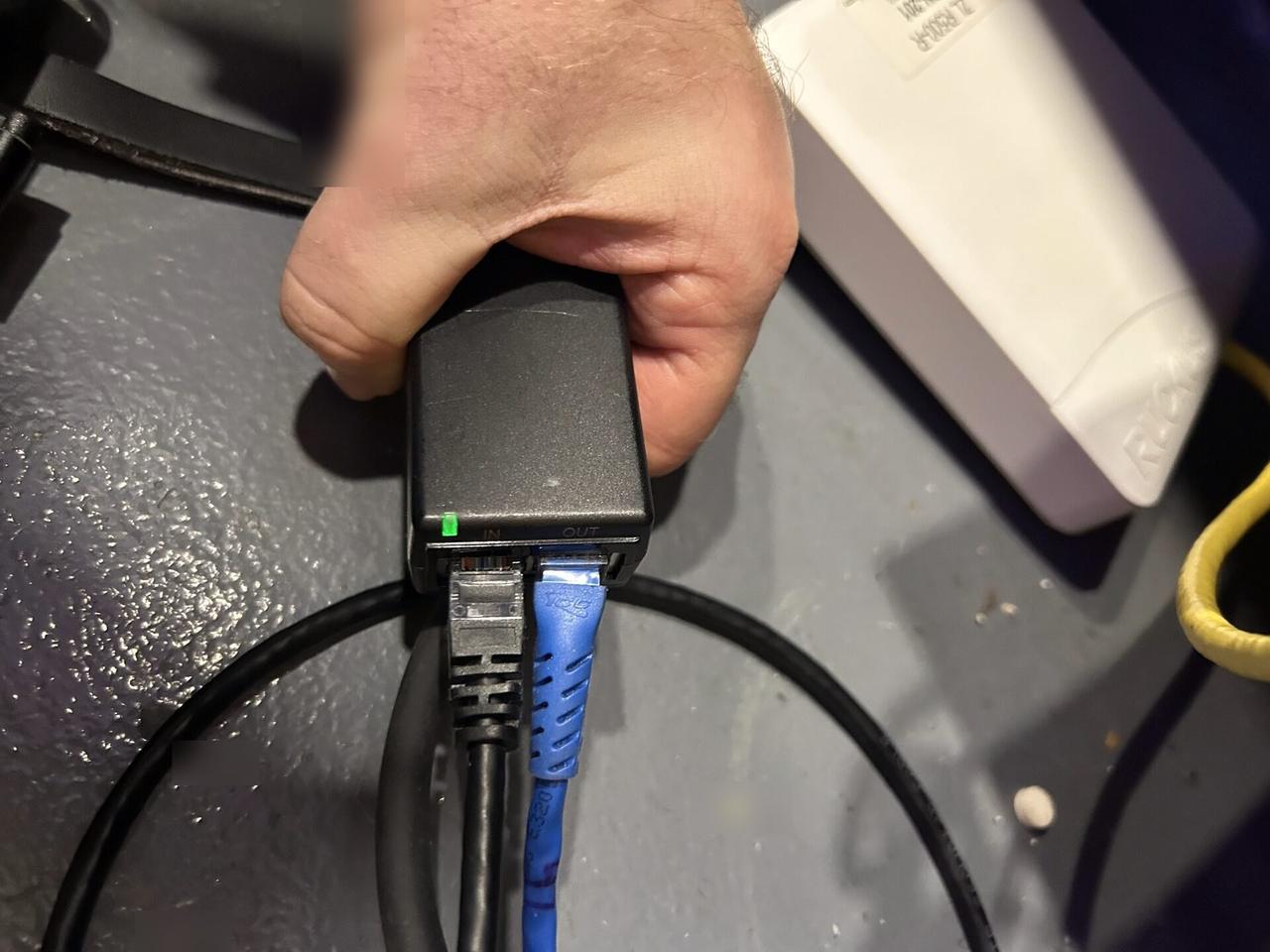 Public-safe portfolio image of network device cabling and connectivity check during router or access point setup