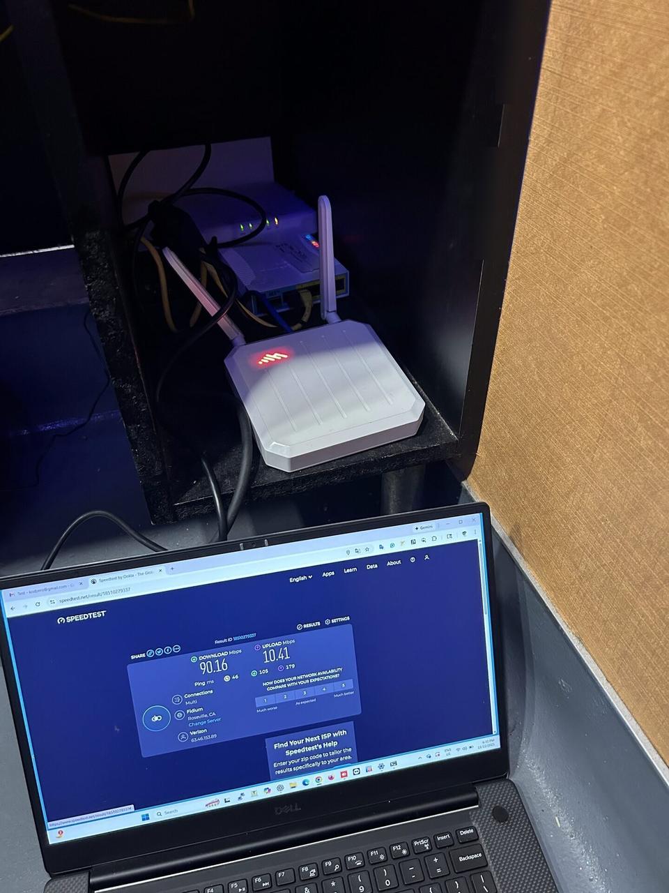 Public-safe portfolio image of network device cabling and connectivity check for onsite Wi-Fi support