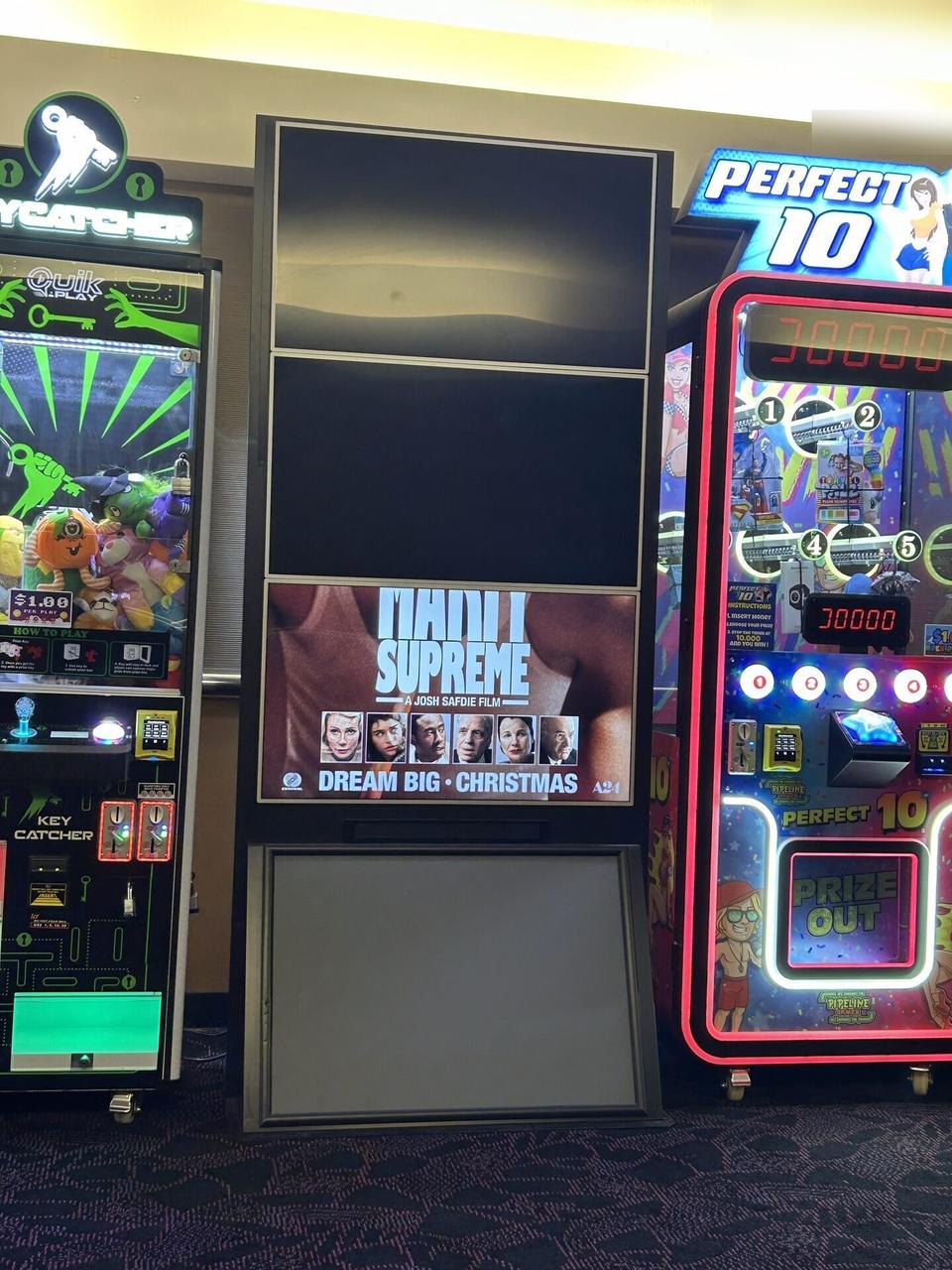 Multi-TV theater poster display assembled from multiple screens during an Alrty onsite service visit