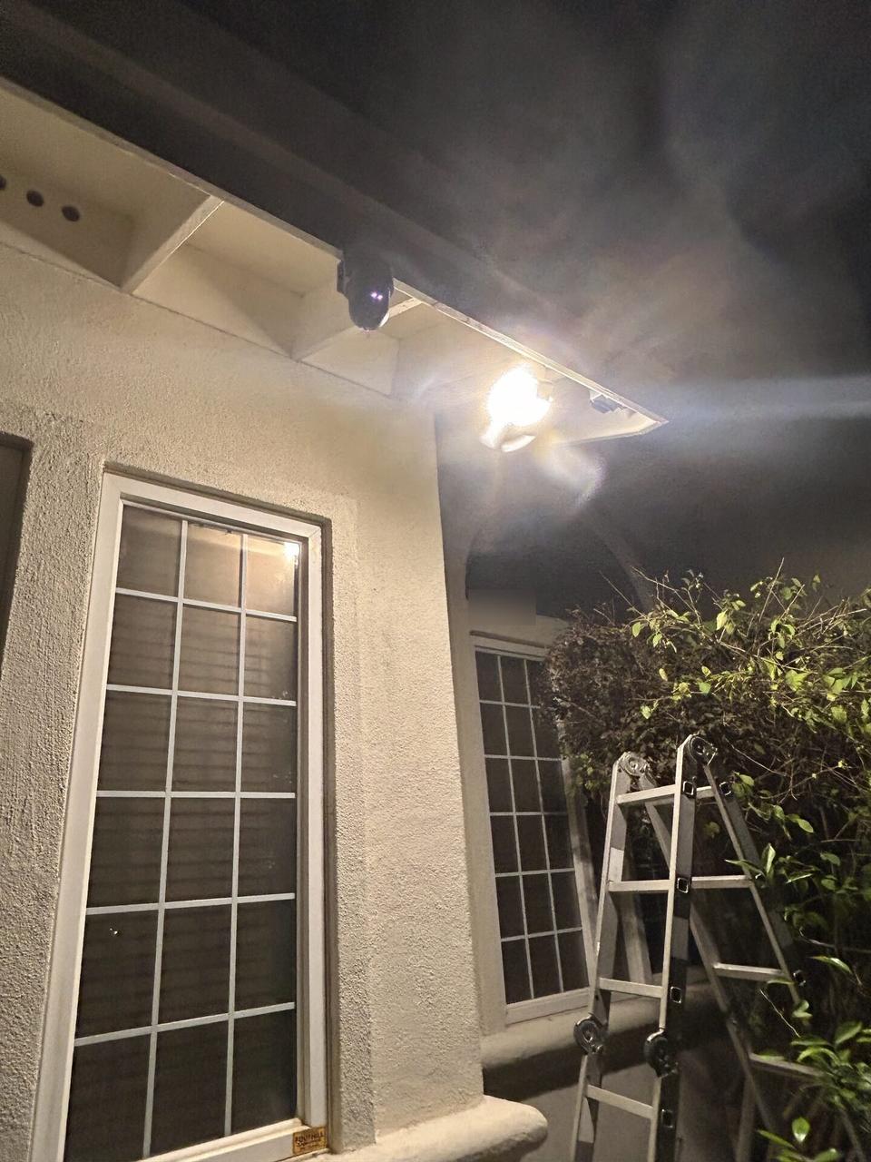 Alrty field photo with security camera installation support detail with low-voltage wiring visible