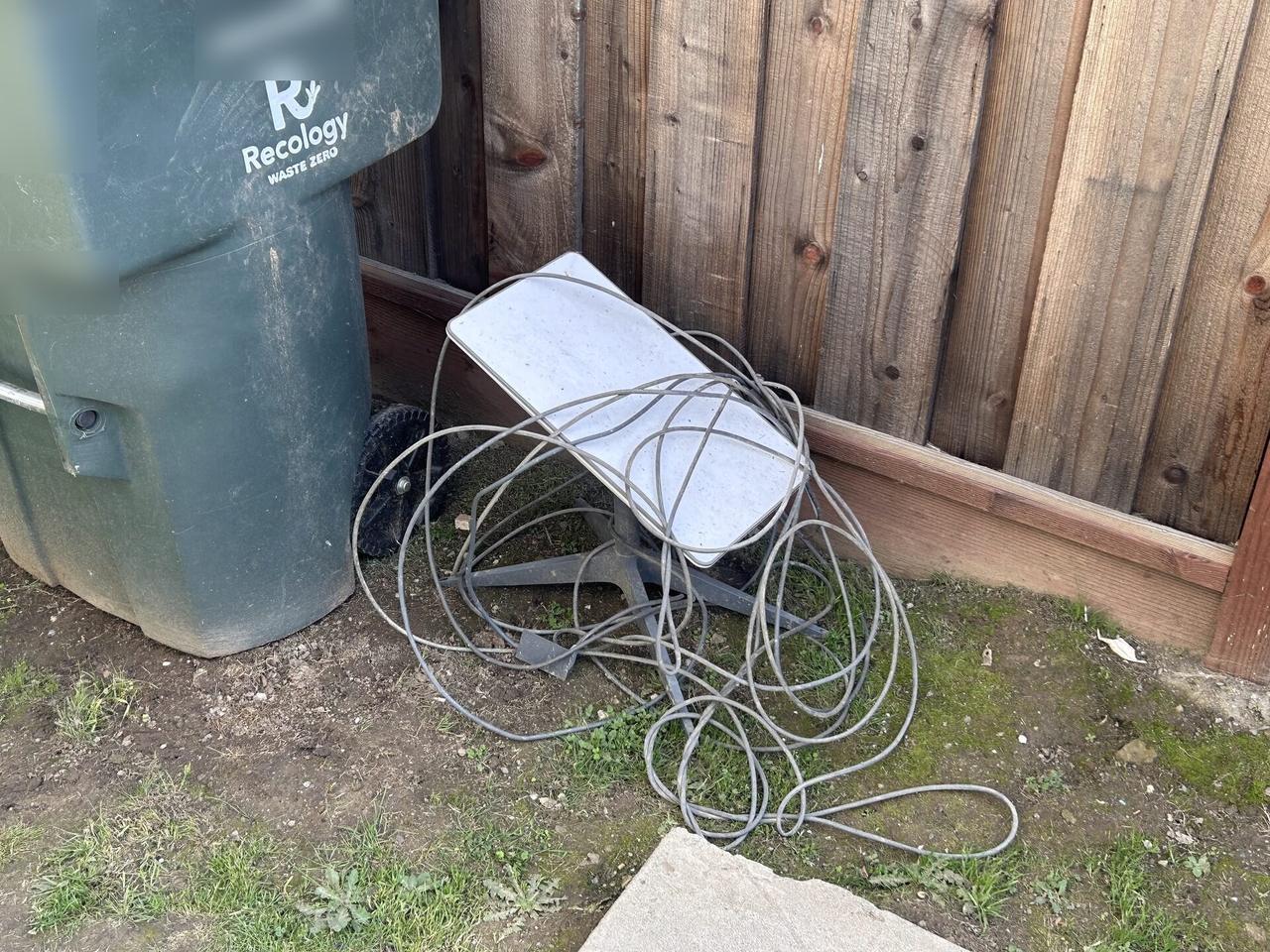 Public-safe portfolio image of broken Starlink antenna and satellite internet hardware
