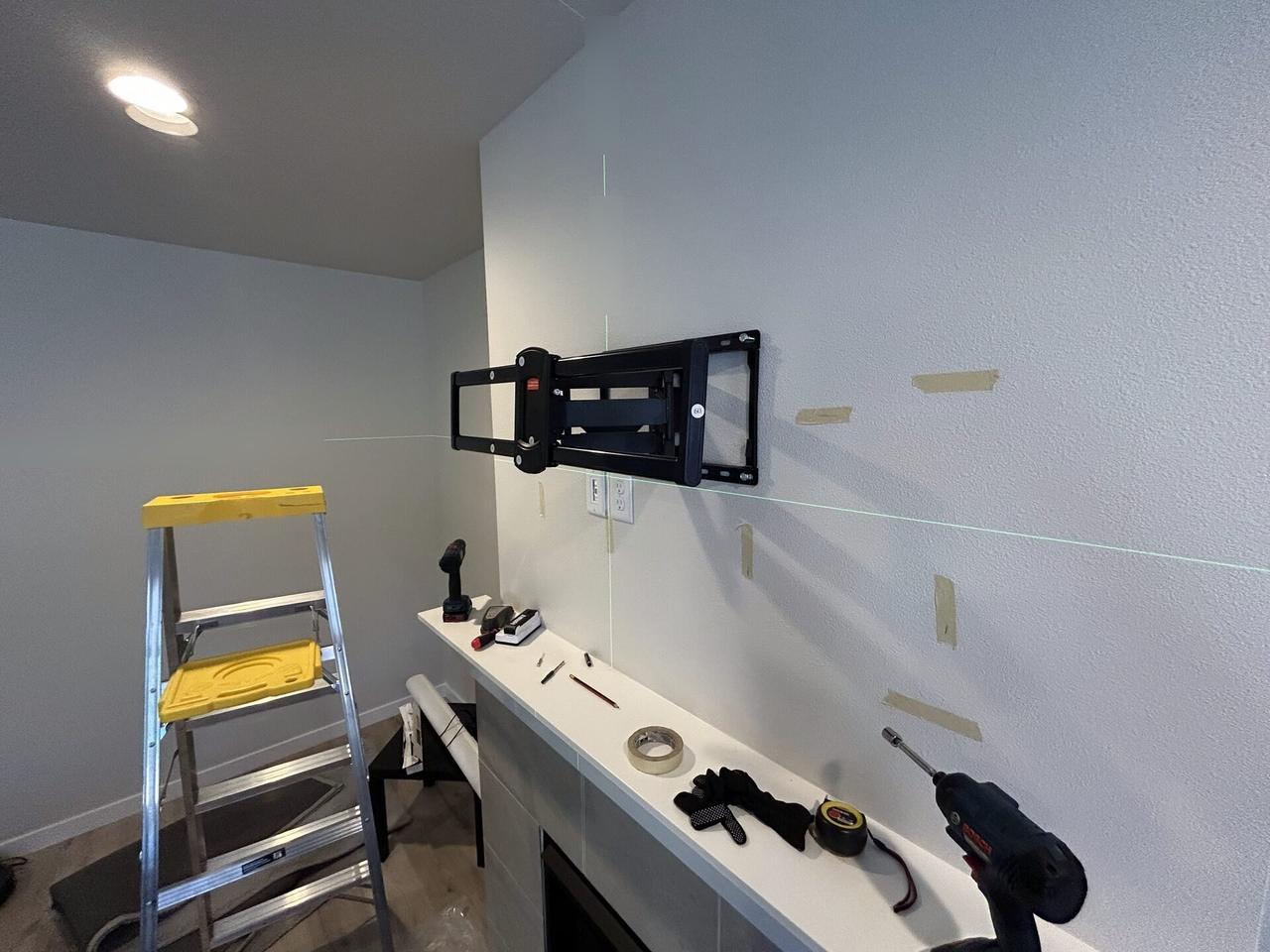 Alrty portfolio view of TV mounting and display setup work during display setup