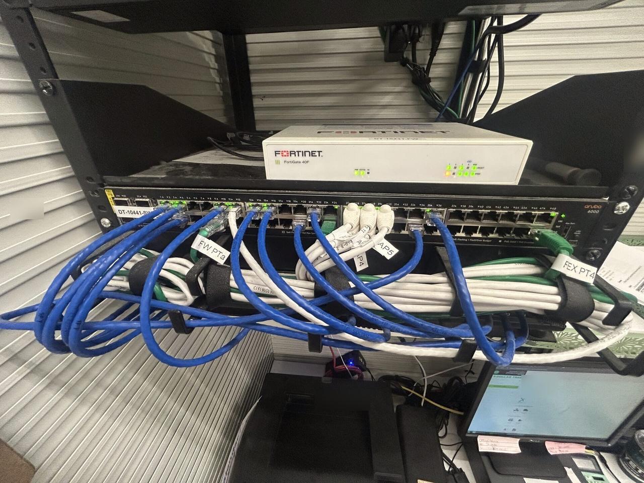 Network switch or router access-point hardware documented for a smart technology service call