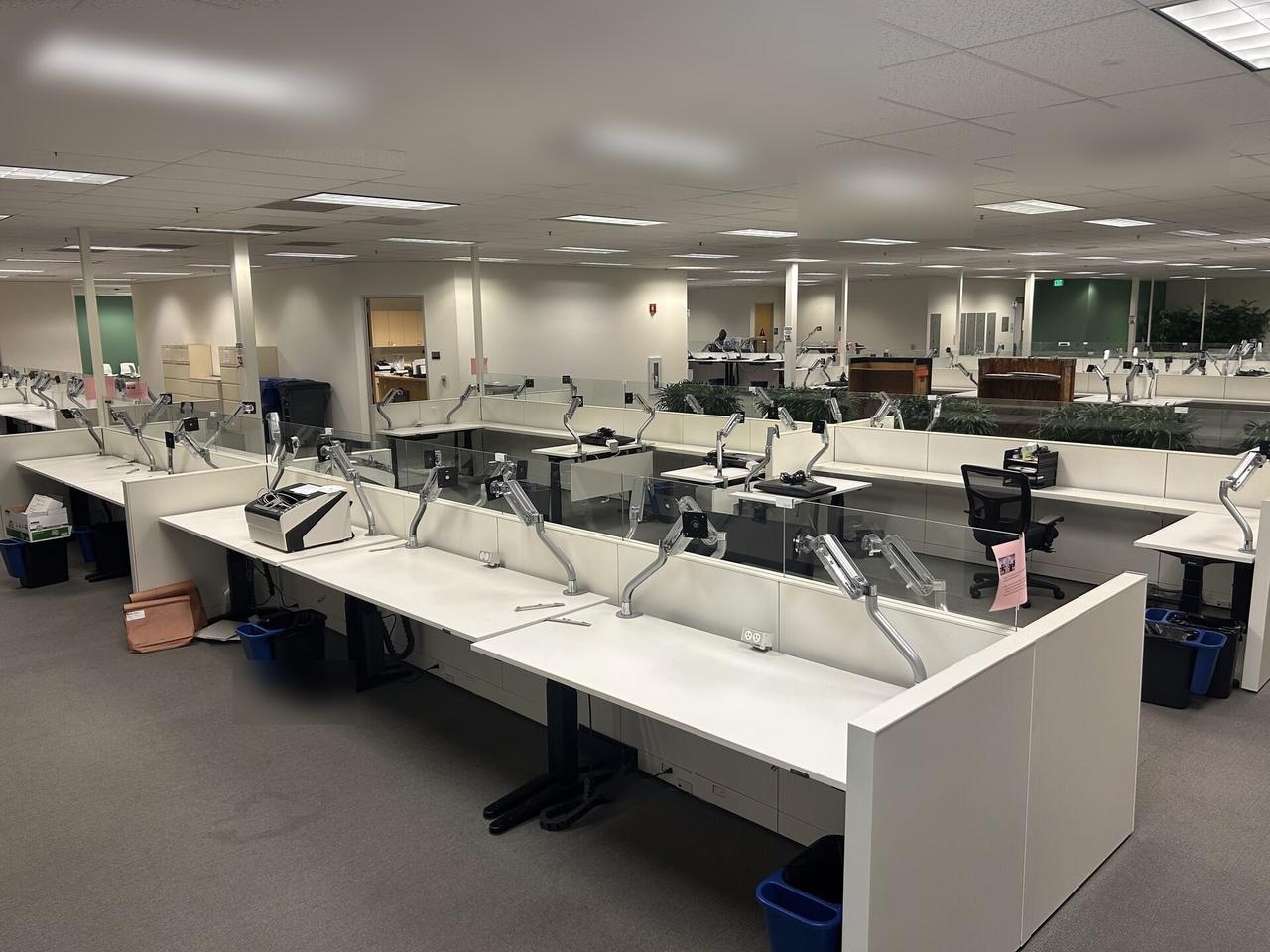 Onsite service photo showing desk-side workstation setup during onsite service before final user handoff