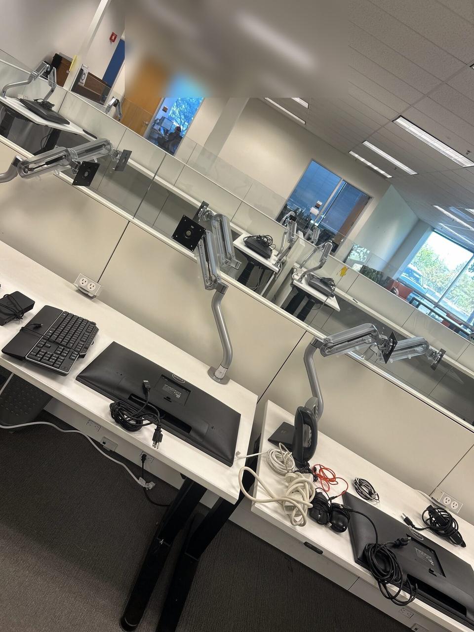 Office workstation setup with monitors before final user handoff documented for a smart technology service call
