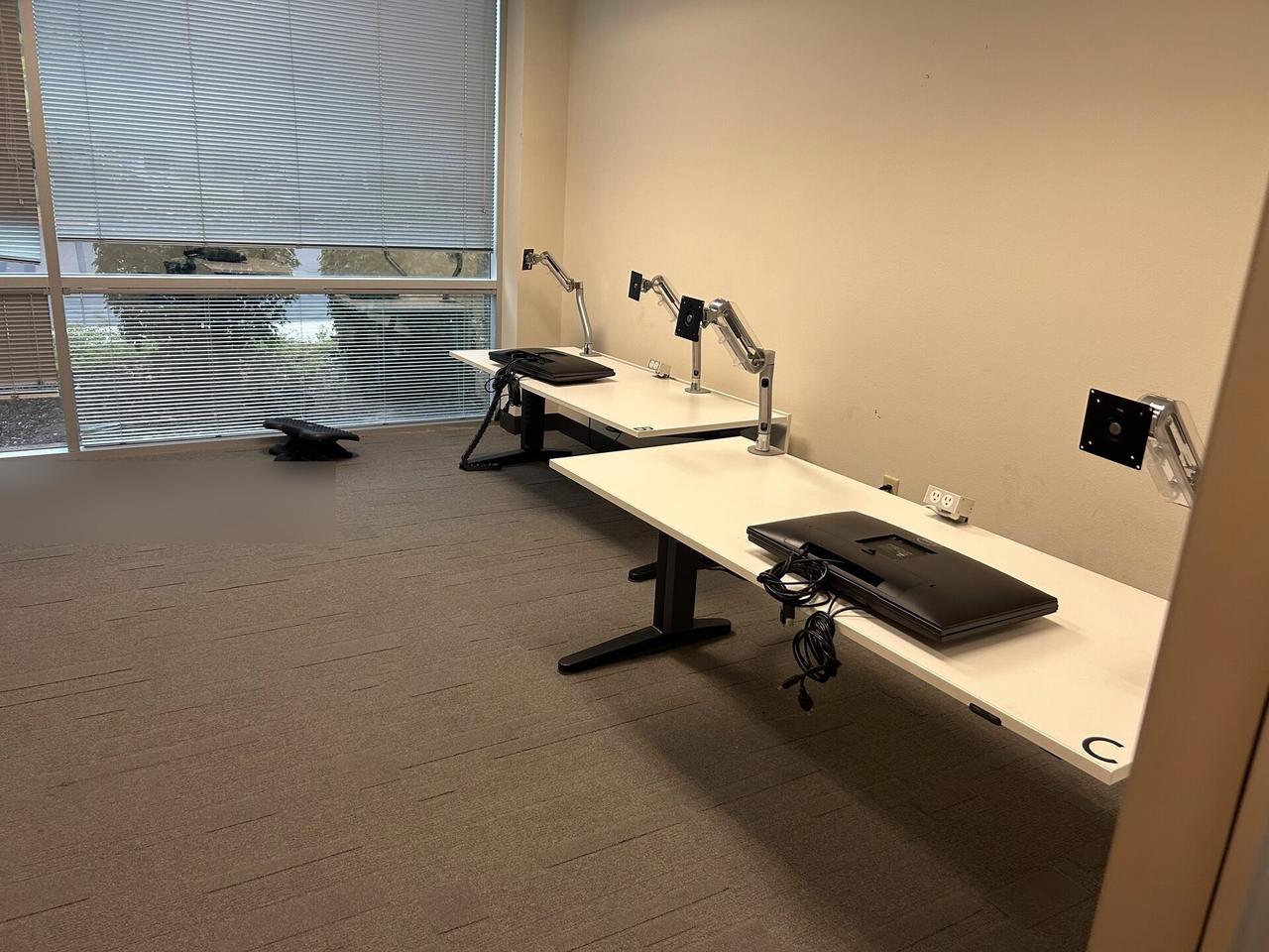 Onsite service photo showing office workstation setup with monitors for office technology support