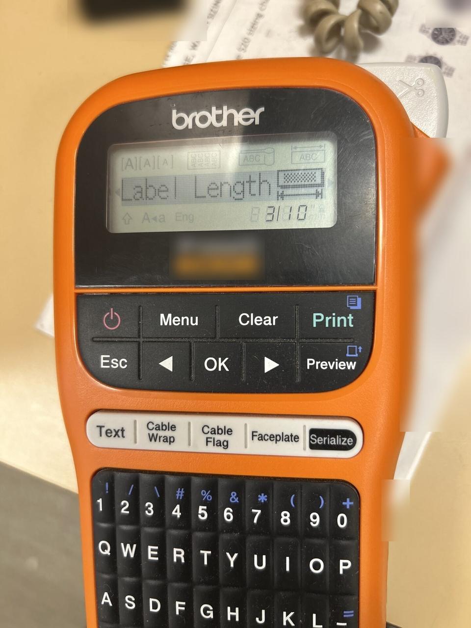 Alrty field photo with label printer used for cable and device labeling