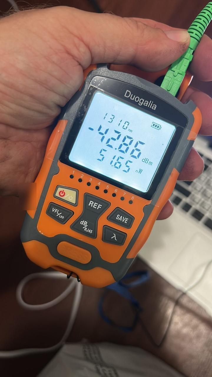 Onsite service photo showing fiber optic dB measurement and signal check