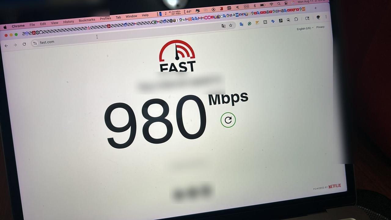 Public-safe portfolio image of optical network equipment during onsite service with private details omitted